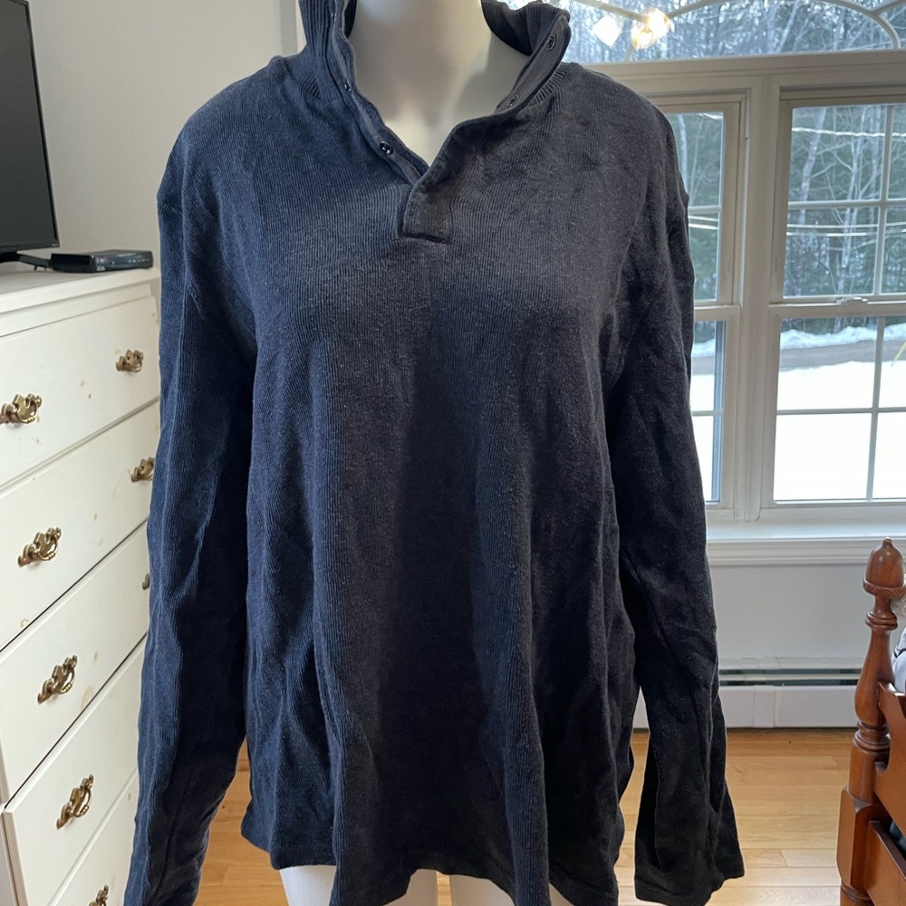 Men’s Mark Law brand sweater with button collar.